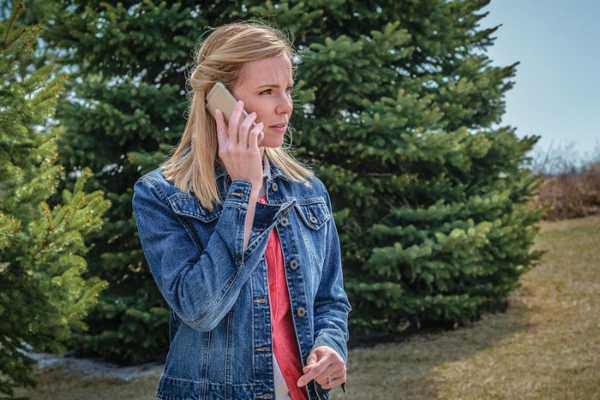 woman making concerned phone call